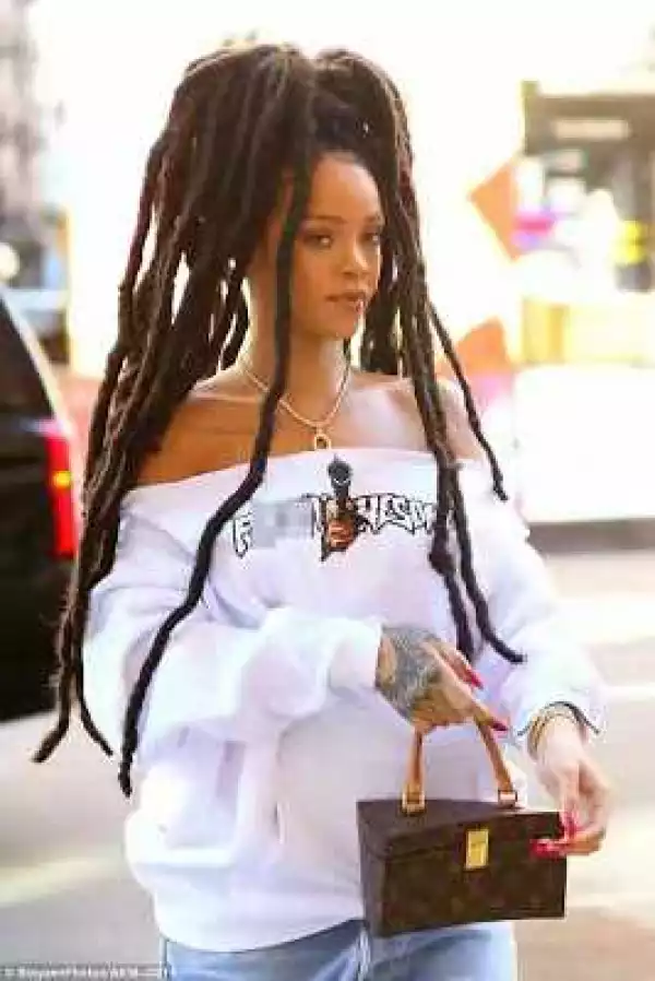 Rihanna Steps Out With Her Huge Dreadlocks & Pair Of Ripped Denim In New York (Photos)